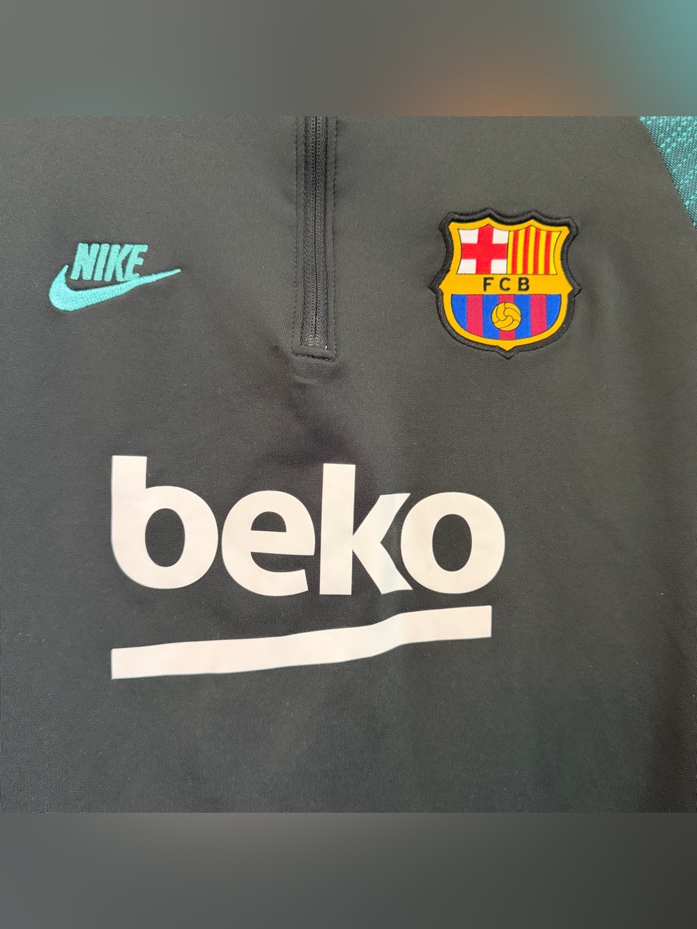 Nike Kids Black Training Top with Teal Nike Swoosh and FC Barcelona Crest